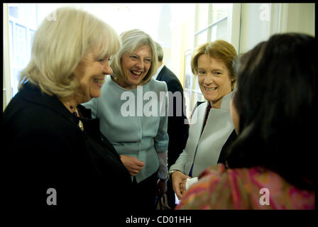 May 13, 2010 - London, UK - Theresa May the new Home Secretary (2nd L) talks to Secretary of State for Wales Cheryl Gillan(L), Caroline Spelman Secretary of State for Environment, Food and Rural Affairs (2nd Right) and Baroness Warsi before going into the first Cabinet meeting of the new government  Stock Photo