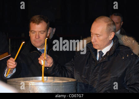 First vice-premier Dmitry Medvedev (l)and President Vladimir Putin at Voznesensky Cathedral in Novocherkassk Stock Photo
