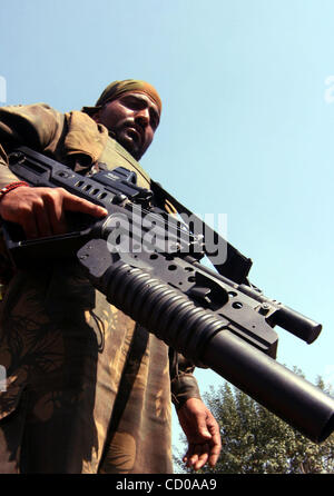 An army officer displays the Tavor-21, an Israeli-made rifle which the army said was effectively used during a week-long gun battle, in an army garrison in Shariefabad on the outskirts of Srinagar-Summer capital of Indian kashmir October 3, 2008. A fierce week-long gun battle between army and Muslim Stock Photo