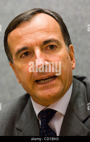 Italian Foreign Minister Franco Frattini, left, addresses reporters ...