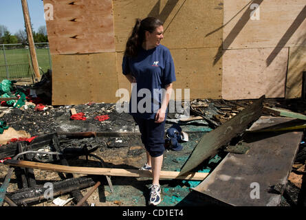 Michelle Kile, a board member for Parkway Little League stands amongst the wreckage left by vandals, who set fire to their snack shop on Sunday.  The Porta-potties were burned, as was their equipment room which held the chidren's uniforms, baseball gloves, lawn mowers and many other necessary items.
