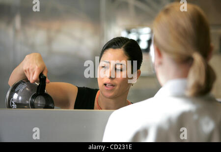 November 13, 2008, Escondido, CA, USA Recently elected Escondido city council member OLGA DIAZ, left, chats with customer CHRISTINE DICKINSON as she pours coffee for her in her downtown Escondido coffee shop Blue Mug Coffee & Tea Credit: photo by Charlie Neuman, San Diego Union-Tribune/Zuma Press. c Stock Photo