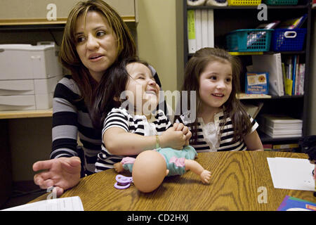 Claudia Lopez, with daughters Jullissa,2, and Arianna,4, Carolina Calderon   at the Children's Center in South San Francisco,Calif., Wednesday, March 5, 2008. Arianna and Julissa  was screened to see if they were special  need children. The program is sponsored by the new program, 'Watch Me Grow'. J Stock Photo