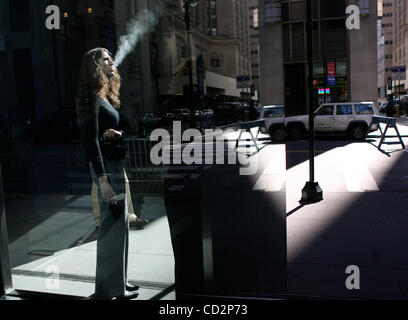 Many cigarrettes breaks for employees at Bear Stearns today. Bear Stearns Headquarters in New York City March, 17 2008. Concerns about the fallout from the bargain-basement sale of Bear Stearns to JPMorgan Chase drove Asian and Europe stocks lower, and U.S. futures plunged overnight.Many cigarrettes Stock Photo