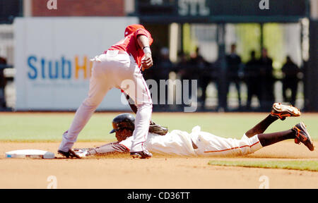 Arizona Diamondbacks second baseman Orlando Hudson, left, regains his  balance after San Diego Padres' Dave Roberts was unable to keep Hudson from  completing a double play during a baseball game Tuesday, May