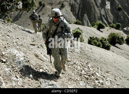 May 02, 2008 - Paktya Province, Afghanistan - A soldier climbs hillside with his platoon of the 101st Abn. patrolling the mountain ridgelines along a fertile valley in eastern Afghanistan, looking for observation and rocket-launching sites used by the Anti-Coalition Militia (ACM).  Charlie Company,  Stock Photo