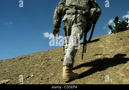 May 02, 2008 - Paktya Province, Afghanistan - A soldier climbs hillside with his platoon of the 101st Abn. patrolling the mountain ridgelines along a fertile valley in eastern Afghanistan, looking for observation and rocket-launching sites used by the Anti-Coalition Militia (ACM).  Charlie Company,  Stock Photo