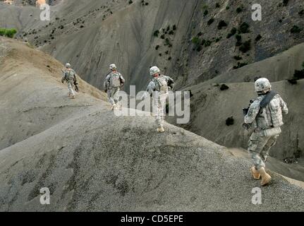 May 02, 2008 - Paktya Province, Afghanistan -  In the quickly dying late of late afternoon soldiers of the 101st Abn., follow a ridgeline down the eastern Afghanistan mountains upon which they spent the day patrolling, looking for observation and rocket-launching sites used by the Anti-Coalition Mil Stock Photo