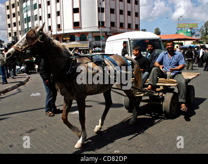 Apr 08, 2008 - Gaza City, Gaza Strip - A Palestinian man rides a horse carriage, outside a gas station in Gaza City, waiting for fuel distributors to sell fuel. Gas station owners are striking against Israel's reduced fuel supplies to their territory. (Credit Image: © Fady Adwan/ZUMA Press) Stock Photo