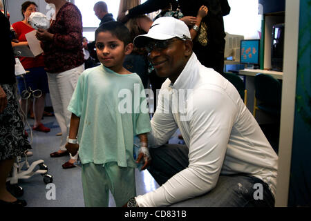 Apr 17, 2008 - Long Beach, CA, USA NFL great ERIC DICKERSON talks with a Miller Children's Hospital patient as participants in this Saturday's Toyota Pro/Celebrity Race on April 19, tour the hospital. The race donates over $90,000 to 'Racing for Kids' which benefits Children's Hospitals in Southern  Stock Photo