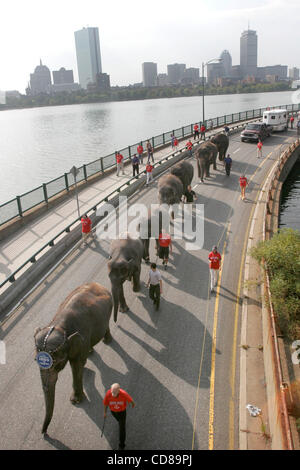 October 2008 With a portion of the skyline of Boston in the background, traffic was tied up on Memorial Drive as 10 elephants among other circus animals made their annual march from Cambridge to the TD Banknorth Garden where the Ringling Bros. Barnum and Bailey Circus performs yearly. Stock Photo