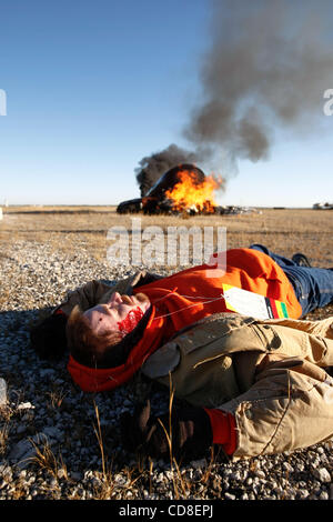 Oct 28, 2008 - Topeka, Kansas, USA - A participant acts as a victim of a plane crash during a disaster drill at Forbes Field in Topeka, Kansas. Several Shawnee and Douglas county emergency agencies conducted the disaster exercise at Forbes Field to train with Department of Homeland Security purchase Stock Photo