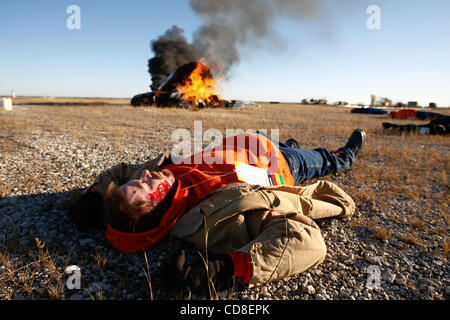 Oct 28, 2008 - Topeka, Kansas, USA - A participant acts as a victim of a plane crash during a disaster drill at Forbes Field in Topeka, Kansas. Several Shawnee and Douglas county emergency agencies conducted the disaster exercise at Forbes Field to train with Department of Homeland Security purchase Stock Photo