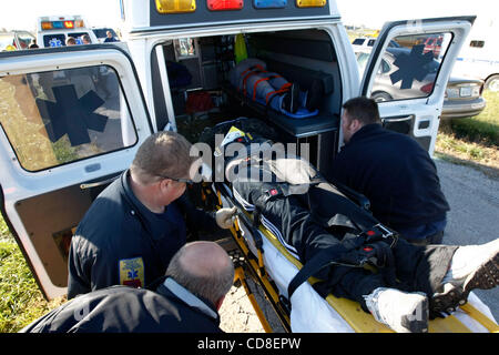 Oct 28, 2008 - Topeka, Kansas, USA - EMS workers load a patient during a disaster drill at Forbes Field in Topeka, Kansas. Several Shawnee and Douglas county emergency agencies conducted the disaster exercise at Forbes Field to train with Department of Homeland Security purchased equipment.   (Credi Stock Photo