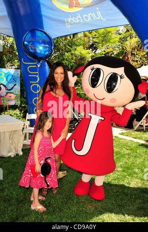 June 27, 2010 - Beverly Hills, California, U.S. - TIA CARRERE and daughter celebrate the launch of childrenÃ•s entertainment brand Juno Baby's ''One For All'' Bus Tour in Los Angeles (Credit Image: © Lisa Rose/ZUMApress.com) Stock Photo
