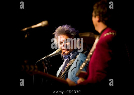 Grand Ole Opry member Marty Stuart (left) introduces bass guitarist Paul Martin of His Fabulous Superlatives band during a performance at the Lakefest Fourth of July Celebration. Martin is from Winchester, Kentucky, and had several family members in attendance. Stock Photo