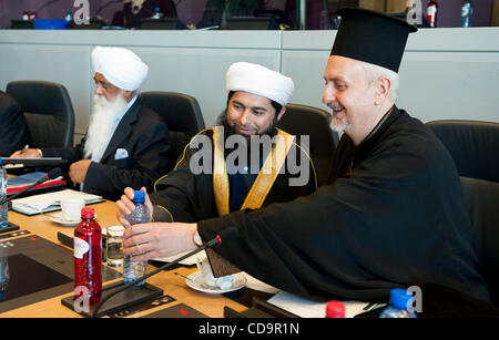 July 19, 2010 - Brussels, BXL, Belgium - (L-R) Bhai Sahib MOHINDER SINGH, Chairman of the Guru Nanak Nishkam Sewak Jatha,  Sheikh Ibrahim Mogra  an imam from Leicester and Chair of the Interfaith Relations Committee of the Muslim Council of Britain,  His Eminence Emmanuel, Metropolitan of France, Pr Stock Photo