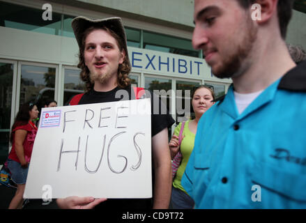 Jul 22, 2010 - San Diego, California, U.S. - Two friends promote free hugs during the Comic Con 2010. (Credit Image: © Mark Samala/ZUMApress.com) Stock Photo