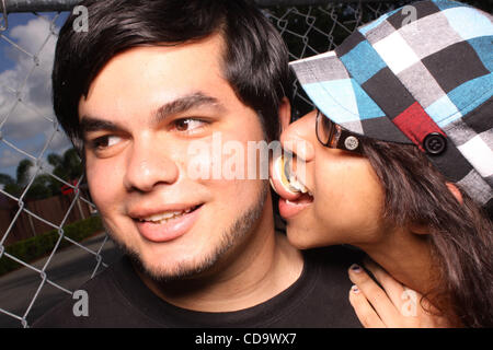 July 24, 2010 - West Palm Beach, Florida, US - JESUS GARCIA, 22, and TIARA PAULINO, 17, both of Miami, Fl, pose for a portrait during the Vans Warped Tour 2010 at Cruzan Amphitheatre. This is Garcia's 7th Vans Warped Tour and Paulino's first. (Credit Image: © Omar Vega/ZUMApress.com) Stock Photo