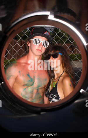 July 24, 2010 - West Palm Beach, Florida, US - DANIEL PAZOS, 17, of Miami Springs, Fl, and NATIANA VEGA, 16, of Miami, Fl, pose for a portrait during the Vans Warped Tour 2010 at Cruzan Amphitheatre. This is Pazos' first Vans Warped Tour and Vega's second. (Credit Image: © Omar Vega/ZUMApress.com) Stock Photo