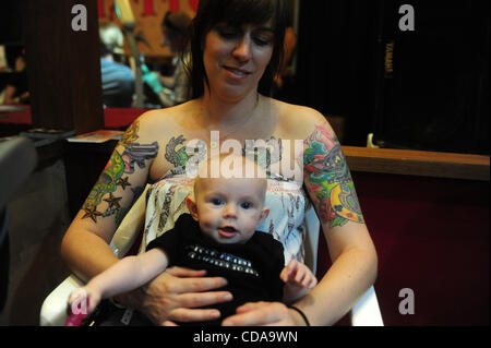 Aug. 15, 2010 - Deerfield Beach, FL - Florida, USA - United States - (CAV) TATTOO 0815M.CAV Alison Cline and her daughter Eva, age 6 months, of Oakland Park, are seen during the 15th Annual South Florida Tattoo Expo, Sunday, Aug. 15, at the Hilton in Deerfield Beach.  Joe Cavaretta, Sun Sentinel (Cr Stock Photo