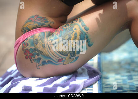 Aug. 15, 2010 - Deerfield Beach, FL - Florida, USA - United States - G(CAV) TATTOO 0815G.CAV The tattooed thigh of Lucy Bitetto of Delray Beach is seen as she relaxes by the pool, during the 15th Annual South Florida Tattoo Expo, Sunday, Aug. 15, at the Hilton in Deerfield Beach.  Joe Cavaretta, Sun Stock Photo