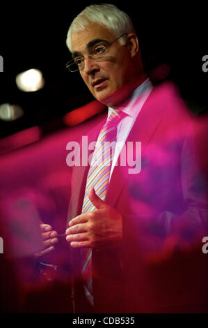 Sep 27, 2010 - Manchester, England, United Kingdom - The Labour logo and auditorim stage reflected in the TV studio glass, ALISTAIR DARLING, Shadow Chancellor of the Exchequer, grants an interview over an afternoon break during the Labour Autumn Conference in Manchester. (Credit Image: Stock Photo