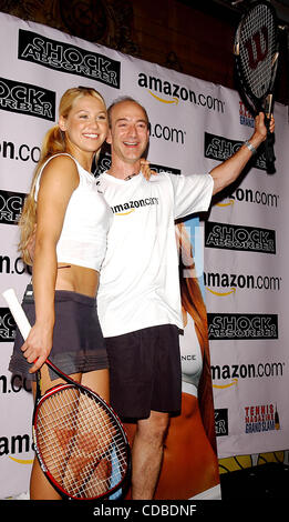 K32368AR.ANNA KOURNIKOVA AND JEFF BEZOS (OF AMAZON.COM) .INTRODUCE ANNA'S NEW SPORTS BRA, .''SHOCK ABSORBER''.AT TENNIS MAGAZINE'S GRAND SLAM; .AN ALL DAY TENNIS FESTIVAL .HELD IN GRAND CENTRAL TERMINAL'S VANDERBILT HALL IN NEW YORK New York. .8/22/2003. / 2003(Credit Image: © Andrea Renault
