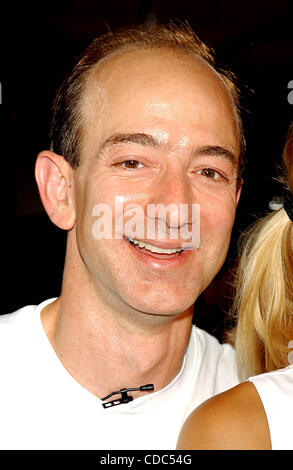 K32368AR.ANNA KOURNIKOVA AND JEFF BEZOS (OF AMAZON.COM) .INTRODUCE ANNA'S NEW SPORTS BRA, .''SHOCK ABSORBER''.AT TENNIS MAGAZINE'S GRAND SLAM; .AN ALL DAY TENNIS FESTIVAL .HELD IN GRAND CENTRAL TERMINAL'S VANDERBILT HALL IN NEW YORK New York. .8/22/2003. / 2003(Credit Image: © Andrea Renault