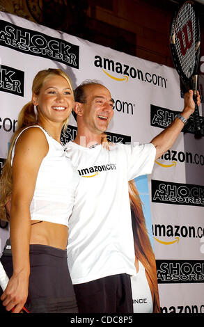 K32368AR.ANNA KOURNIKOVA AND JEFF BEZOS (OF AMAZON.COM) .INTRODUCE ANNA'S NEW SPORTS BRA, .''SHOCK ABSORBER''.AT TENNIS MAGAZINE'S GRAND SLAM; .AN ALL DAY TENNIS FESTIVAL .HELD IN GRAND CENTRAL TERMINAL'S VANDERBILT HALL IN NEW YORK New York. .8/22/2003.     /    2003(Credit Image: Â© Andrea Renault