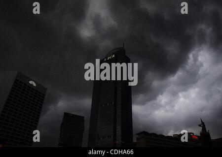 Feb 01, 2011 - Jakarta, Indonesia - Heavy clouds release rain over the capital city of Jakarta, Indonesia. Indonesia's annual consumer prices index (CPI) surpassed the 7 percent level in January, as pressure remained heavy from surging food prices, mainly those of rice and chili, the Central Statist Stock Photo