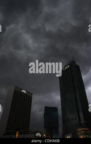 Feb 01, 2011 - Jakarta, Indonesia - Heavy clouds release rain over the capital city of Jakarta, Indonesia. Indonesia's annual consumer prices index (CPI) surpassed the 7 percent level in January, as pressure remained heavy from surging food prices, mainly those of rice and chili, the Central Statist Stock Photo