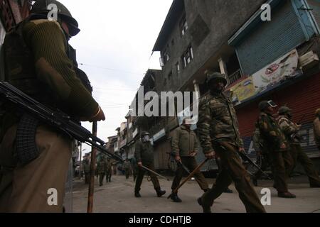 Feb 11, 2011 - Srinagar, Kashmir, India - Indian Policemen stand guard during a clash mark the 27th death anniversary of Jammu and Kashmir Libration Front (JKLF) founder Maqbool Bhat in the summer capital of Indian Kashmir. Kashmiri seperatist leaders and supporters called for a general strike to ma Stock Photo