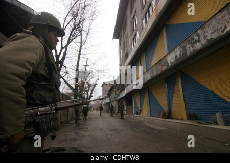 Feb 11, 2011 - Srinagar, Kashmir, India - Indian Central Reserve Police Force (CRPF) soldiers stand guard during a one day strike to mark the 27th death anniversary of Jammu and Kashmir Liberation Front (JKLF) founder Maqbool Bhat in Srinagar the summer capital of Indian Kashmir. Kashmiri seperatist Stock Photo