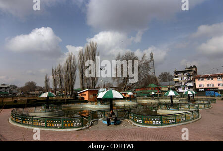 Feb 11, 2011 - Srinagar, Kashmir, India - A Kashmiri muslim reading news paper at a park during a one day strike to mark the 27th death anniversary of Jammu and Kashmir Libration Front (JKLF) founder Maqbool Bhat in Srinagar the summer capital of Indian Kashmir. Kashmiri seperatist leaders and suppo Stock Photo