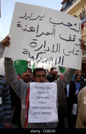 Feb 17, 2011 - Ramallah, West Bank, Palestinian Territories - Palestinians take part in a rally calling for ending the Palestinian division, in the West Bank city of Ramallah. More than 3000 protesters call for free elections and the reconciliation between the two rival factions of Fatah and Hamas.  Stock Photo