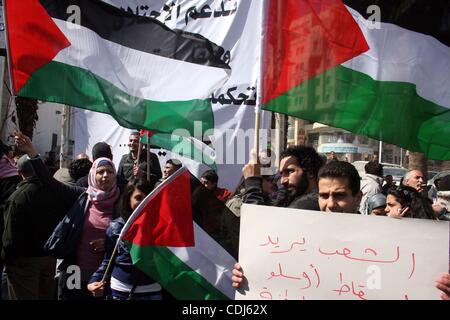 Feb 17, 2011 - Ramallah, West Bank, Palestinian Territories - Palestinians take part in a rally calling for ending the Palestinian division, in the West Bank city of Ramallah. More than 3000 protesters call for free elections and the reconciliation between the two rival factions of Fatah and Hamas.  Stock Photo