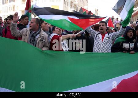 Feb 17, 2011 - Ramallah, West Bank, Palestinian Territories - Palestinians take part in a rally calling for ending the Palestinian division, in the West Bank city of Ramallah. More than 3000 protesters call for free elections and the reconciliation between the two rival factions of Fatah and Hamas.  Stock Photo