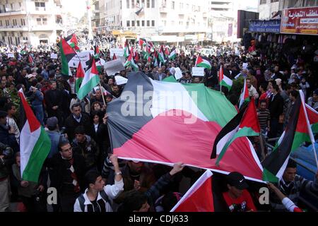 Feb 17, 2011 - Ramallah, West Bank, Palestinian Territories - Palestinians take part in a rally calling for ending the Palestinian division, in the West Bank city of Ramallah. More than 3000 protesters call for free elections and the reconciliation between the two rival factions of Fatah and Hamas.  Stock Photo