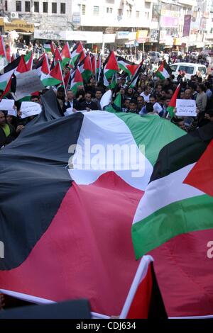 Feb 17, 2011 - Ramallah, West Bank, Palestinian Territories - Palestinians take part in a rally calling for ending the Palestinian division, in the West Bank city of Ramallah. More than 3000 protesters call for free elections and the reconciliation between the two rival factions of Fatah and Hamas.  Stock Photo