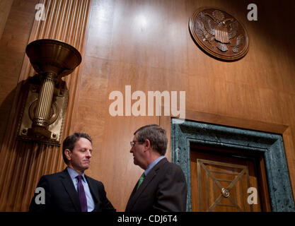 Feb 17, 2011 - Washington, District of Columbia, U.S. - Treasury Secretary TIMOTHY GEITHNER speaks with Senator KENT CONRAD (D-ND) before testifying at a Senate Budget Committee hearing on the President's FY2012 budget and revenue proposals. (Credit Image: © Pete Marovich/ZUMAPRESS.com) Stock Photo