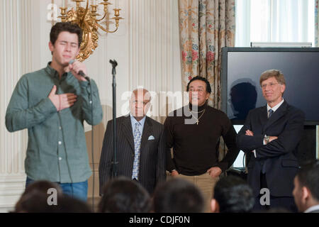 Feb 24, 2011 - Washington, District of Columbia, U.S. - .Motown Records founder BERRY GORDY, JOHN LEGEND, SMOKEY ROBINSON and The Grammy MuseumÃ•s Executive Director BOB SANTELLI look on as NICK JONAS performes in the State Dining Room at the White House. They were participating in a interactive stu Stock Photo