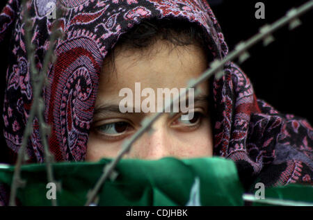 Feb 26, 2011 - Srinagar, Kashmir, India - Supporters listen to a speech by opposition People's Democratic Party (PDP) Mufti Mohammad Syeed addressing a public meeting Saturday. The PDP said in order to resolve the Kashmir issue, a round-table conference should follow confidence building measures tak Stock Photo