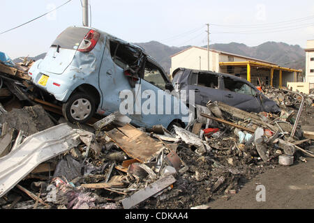 Mar. 14, 2011 - Kamaishi, Japan - Cars which have been carried by Tsunami are seen in Kamaichi, Iwate, Japan. Magnitude 9.0 earthquake hit Northern Japan. Several tens of thousands of people are still missing. (Credit Image: © Junko Kimura/Jana Press/ZUMAPRESS.com) Stock Photo
