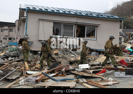 Mar. 15, 2011 - Miyako, Japan - Members of Japan Self Defense Forces search for missing people among the collapsed house in Miyako, Iwate, Japan. The Magnitude 9.0  earthquake hit Northern Japan. Several tens of thousands of people are still missing. (Credit Image: © Junko Kimura/Jana Press/ZUMAPRES Stock Photo