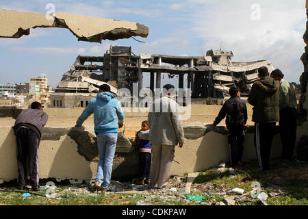 Palestinians observe the destroyed security office in Gaza City, on March 25, 2011, as Israeli aircraft attacked four targets in the Gaza Strip during the night, lightly wounding three people, in response to Palestinian rocket attacks on Israel. Photo by Ashraf Amra Stock Photo