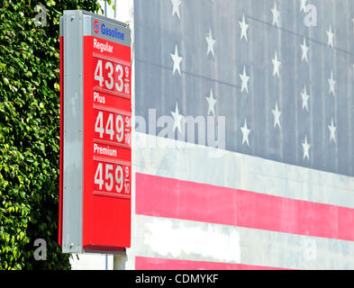 A patriotic mural is seen next to gas prices posted in the $4.00 range at a 76 station in Hollywood, California on April 16, 2011.  With the price of gas above $3.50 a gallon in all but one state, there are signs that Americans are cutting back on driving, reversing a steady increase in demand for f Stock Photo
