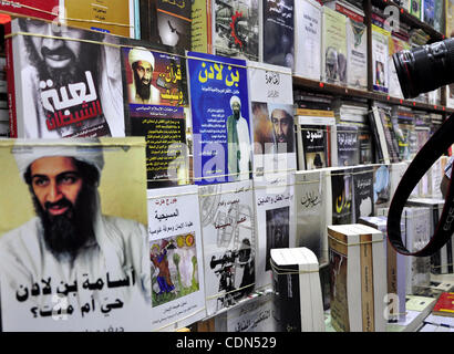 Books with the front page displaying Osama bin Laden are seen at a stall in Cairo, Egypt on May 3, 2011. Bin Laden was shot dead deep inside Pakistan in a night-time helicopter raid by US commandos on May 1, ending a decade-long manhunt for the mastermind of the 9/11 attacks. Photo by Ahmed Asad Stock Photo