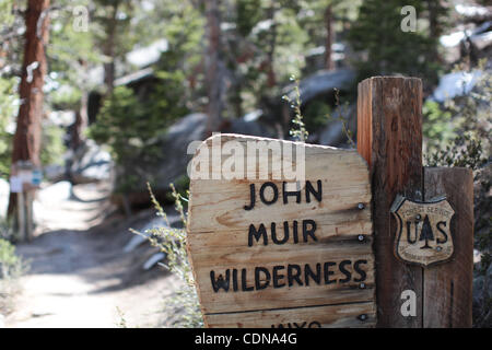 A sign marks the famed John Muir Trail up Mount Whitney which is the tallest peak in the contiguous United States reaching an elevation of 14,505 feet. Stock Photo