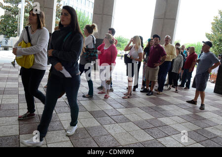 June 27, 2011 - Orlando, Florida, U.S. - Spectators, carrying their entrance tickets with seat assignments, enter the Orange County Courthouse to witness the Casey Anthony murder trial. Casey Anthony is charged with killing her two-year-old daughter Caylee in 2008. (Credit Image: &#169; Phelan Ebenh Stock Photo
